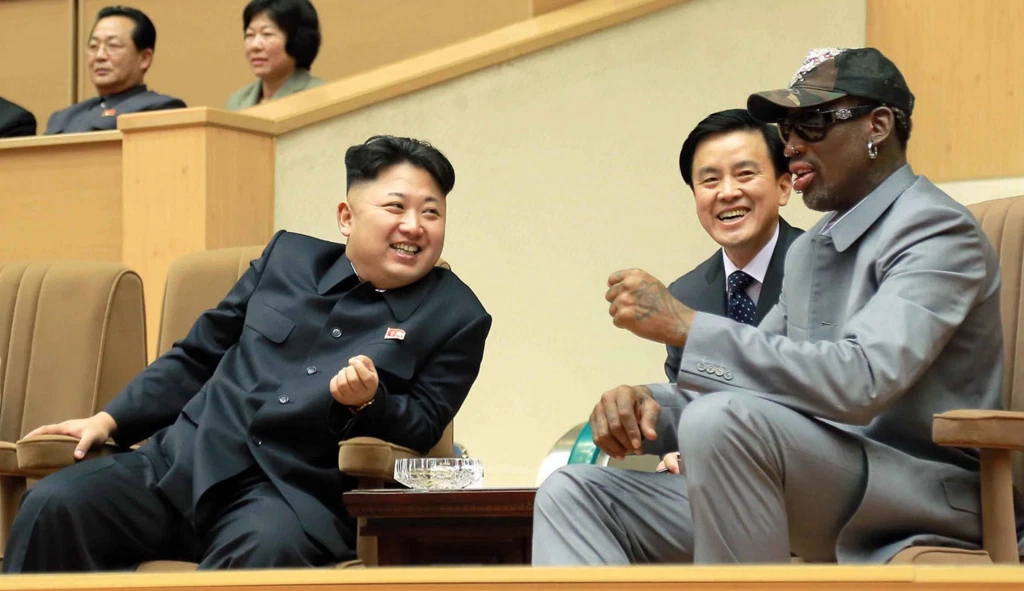 North Korean leader Kim Jong Un talks with former NBA player Dennis Rodman, as they watch an exhibition basketball game in Pyongyang. (Korean Central News Agency/Korea News Service via AP)