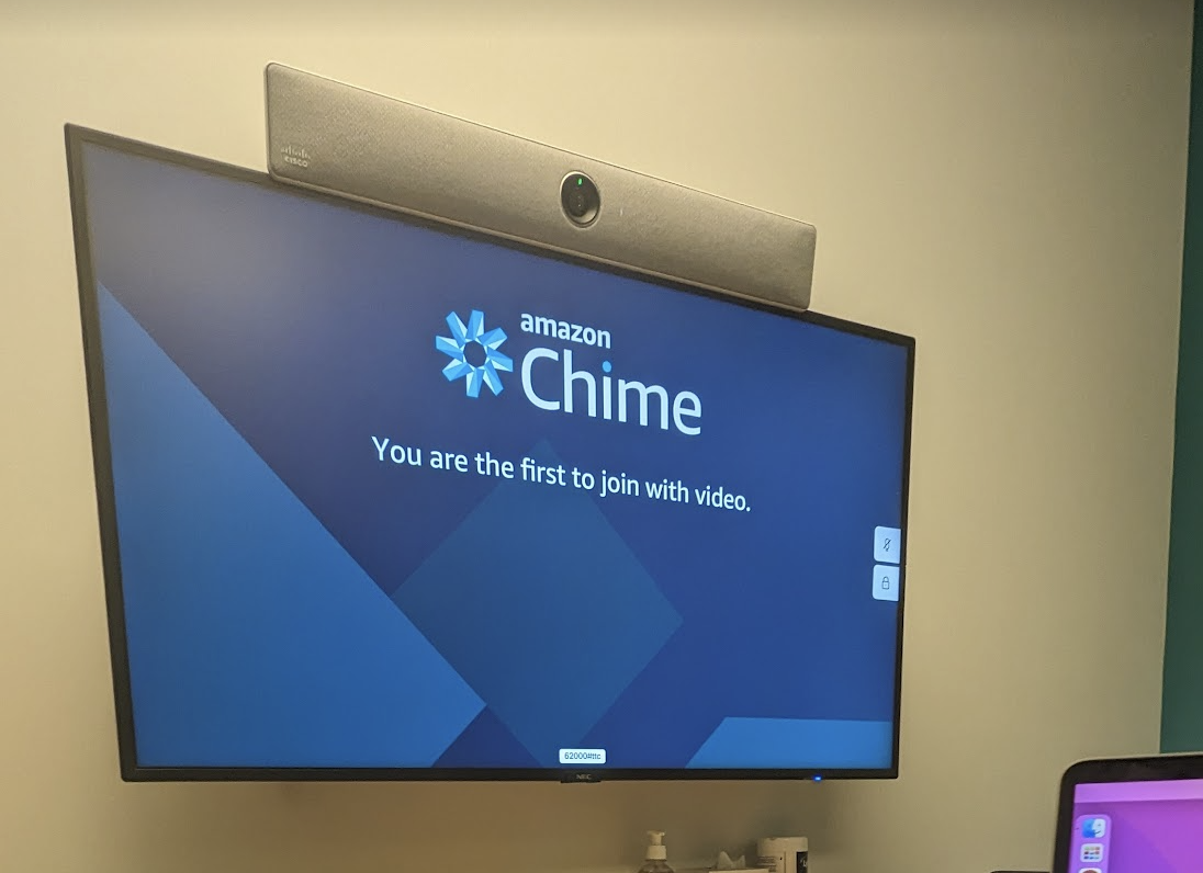 A tv screen with Amazon Chime running